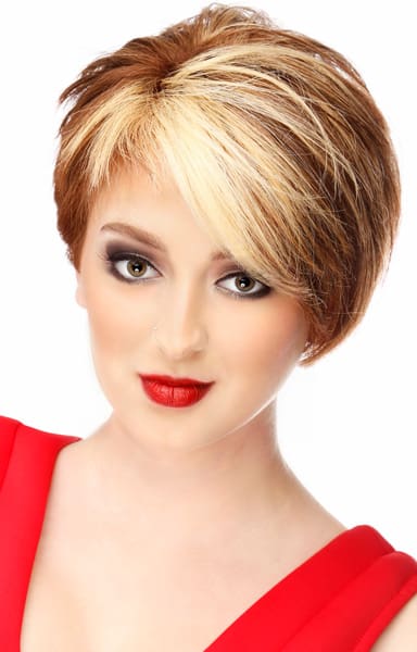 Chucky blonde asymmetrical bangs on deep red colored short bob.