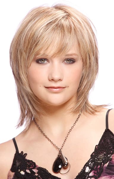 Multi-layered face-framing lob haircut with dimensional blonde hair color.